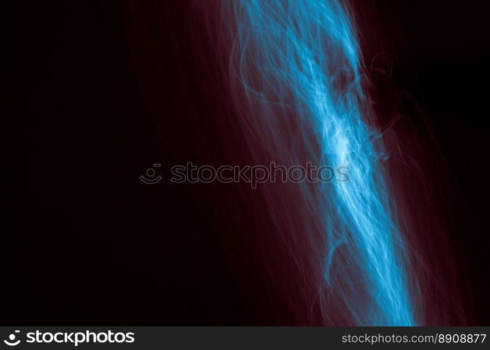 Light painted glowing abstract blue and red curved lines on a black background