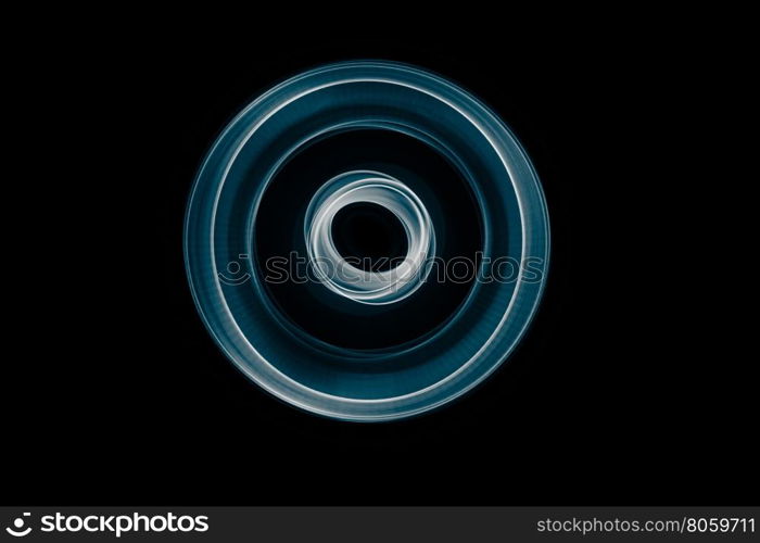 Light painted glowing abstract blue and white curved lines on a black background