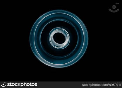 Light painted glowing abstract blue and white curved lines on a black background