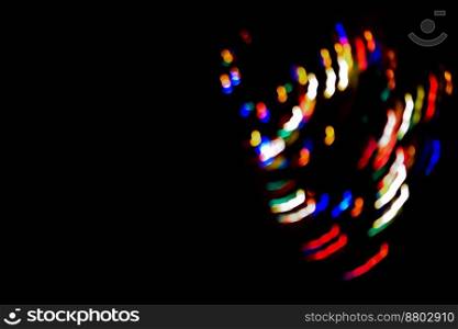 Light painting be creative blurry effect bokeh background on a black.. Light dreamlike painting light source to blur bokeh texture on a black background