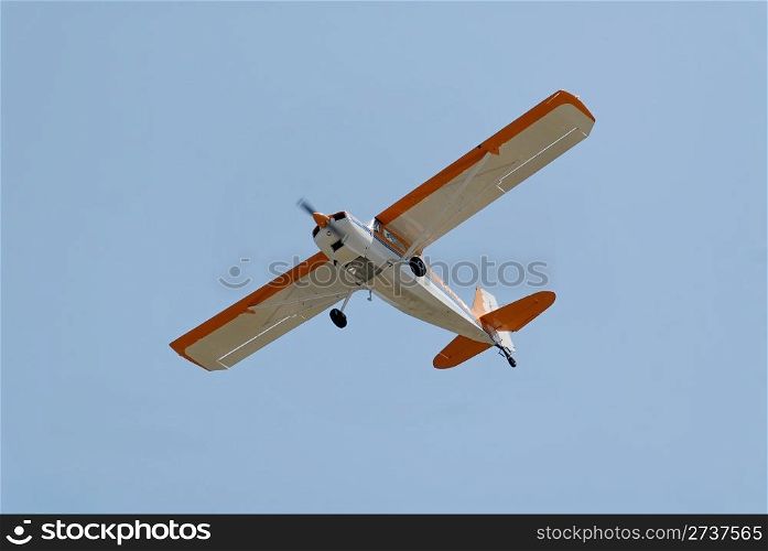Light plane flying overhead, Palo Alto Airport, California