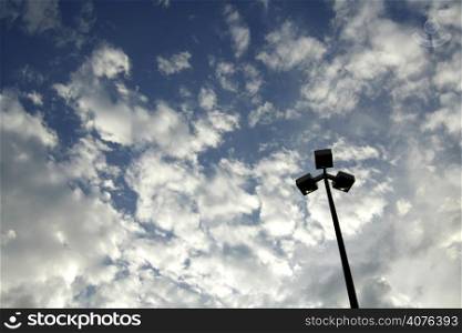 Light pole and stormy clouds