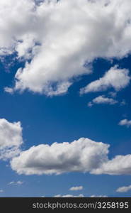 Light post with clouded sky background