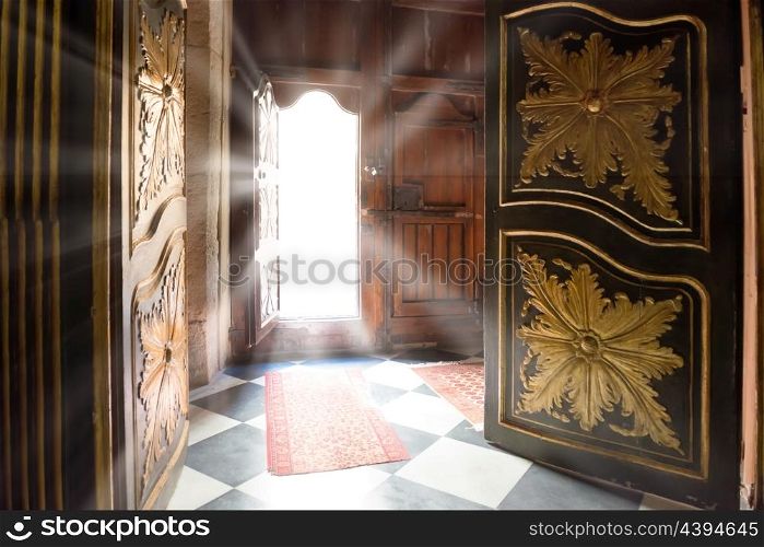 Light rays from the old wooden door. Concept interior of dark room