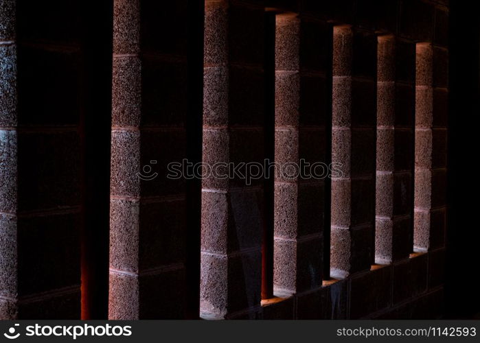 light rays through the brick old window on the wall