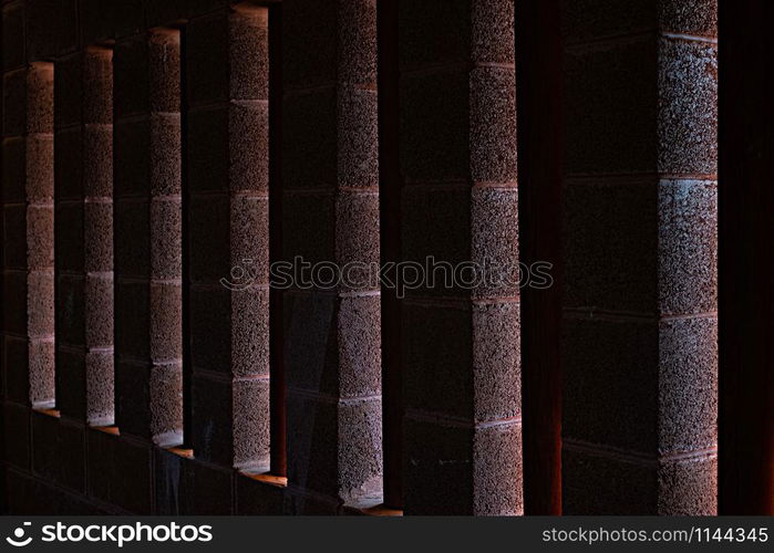 light rays through the brick old window on the wall