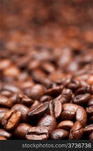 light roasted coffee beans background with focus foreground