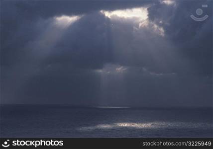 Light Shining Through Clouds onto the Ocean