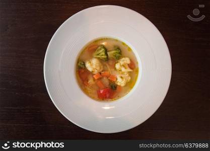 Light soup of fresh vegetables. Healthy food. Low-Carb Diet. Vegetarian food.. Light soup of fresh vegetables