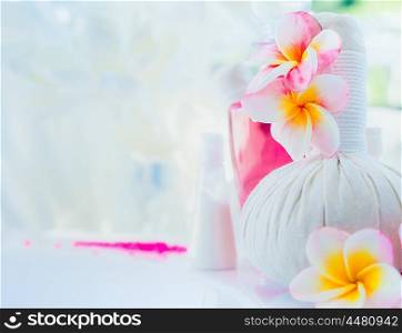 Light Spa background with frangipani flowers and wellness tools, place for text