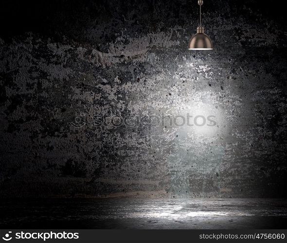 Light spot. Background image of dark wall with lamp above