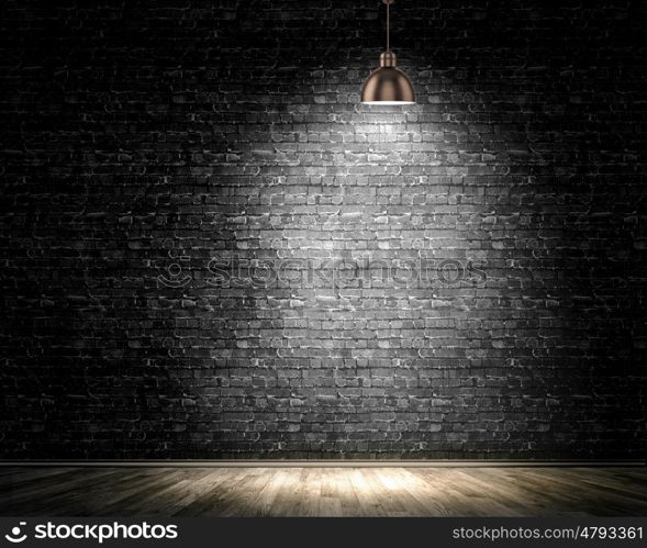 Light spot. Background image of dark wall with lamp above