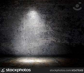 Light spot. Background image of dark wall with light spot