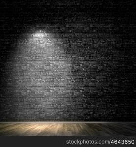 Light spot. Background image of dark wall with light spot