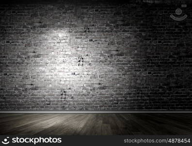 Light spot. Background image of dark wall with light spot