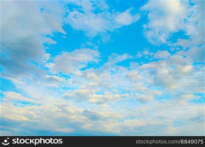 Light white clouds in blue sky. Heavenly landscape.