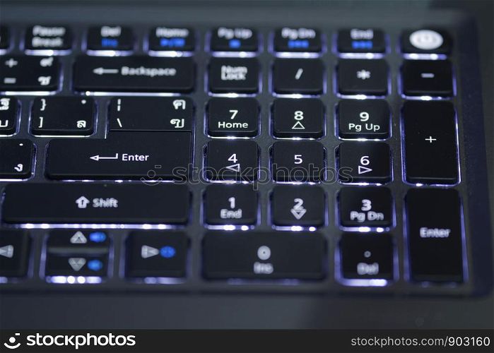 Light with keyboard, typing language, English and Thai.