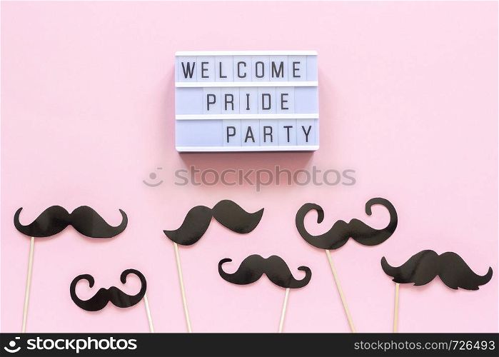 Lightbox text Welcome pride party and paper mustache props on pink background. Concept Homosexuality gay love National Day Against Homophobia or International Gay Day Top view Card invitation.. Lightbox text Welcome pride party and paper mustache props on pink background. Concept Homosexuality gay love National Day Against Homophobia or International Gay Day Top view Card invitation