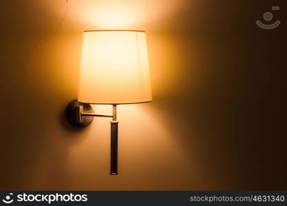 Lighted classic lamp on the wall