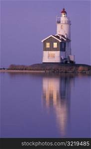 Lighthouse and Calm Water