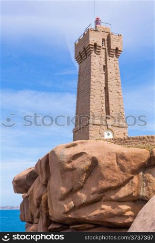 Lighthouse and rocks on Pink Granite Coast in Brittany, in northwestern France.