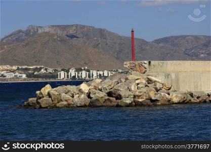 lighthouse and small fishing port in the town of Mazarron, Spain