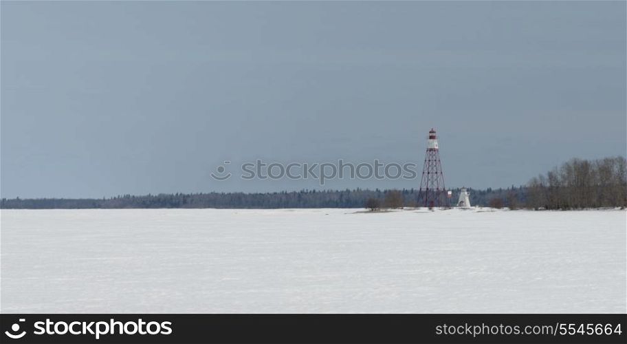 Lighthouse and watch tower at the frozen lakeside, Riverton, Hecla Grindstone Provincial Park, Manitoba, Canada