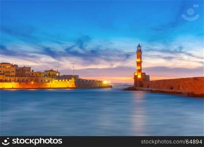 Lighthouse at sunset, Chania, Crete, Greece. Panorama venetian harbour waterfront and Lighthouse in old harbour of Chania at sunset, Crete, Greece