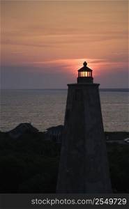 Lighthouse at sunset on Bald Head Island, North Carolina.
