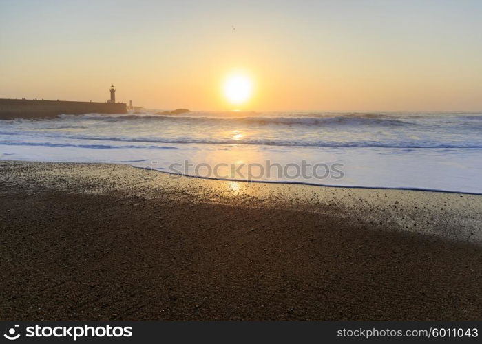 Lighthouse Felgueirasin Porto with wave splash at sunset, Porto, Portugal&#xA;