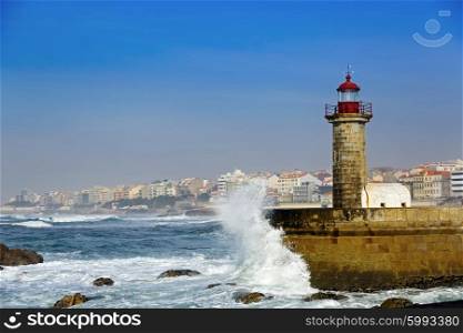 Lighthouse Felgueirasin Porto with waves and cityscape, sunny day