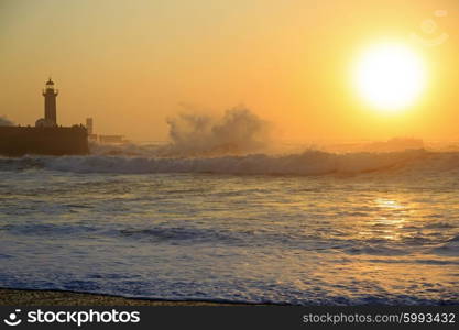 Lighthouse Felgueirasin Porto with waves and sun at sunset&#xA;