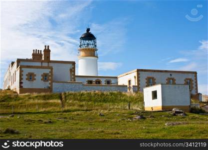 Lighthouse in Sutherland, Scotland, close to cliffs