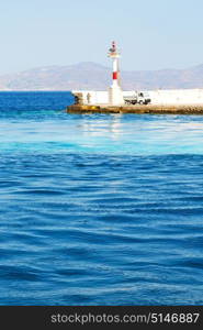 lighthouse in the mediterranean sea cruise greece island in santorini europe boat harbor and pier