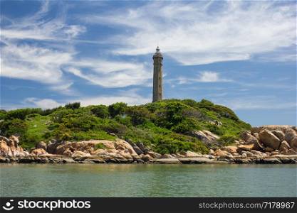 Lighthouse Ke Ga on an island,Vietnam, picturesque view. Lighthouse Ke Ga,view from rhe sea, Binh Thuan,Vietnam