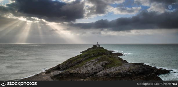 Lighthouse landscape with stormy sky over sea