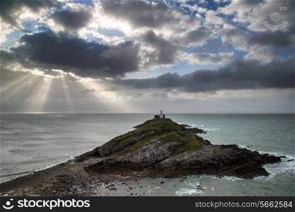 Lighthouse landscape with stormy sky over sea