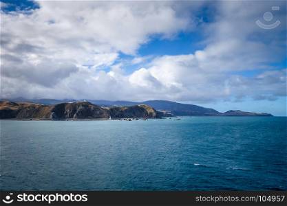 Lighthouse on cliffs near Wellington city, New Zealand. Lighthouse on cliffs near Wellington, New Zealand