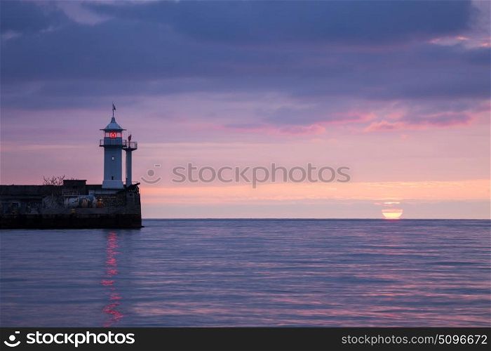 Lighthouse on sunrise. Yalta, Crimea, Ukraine