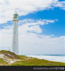 Lighthouse on the rugged Cape Town South Africa coastline during the day