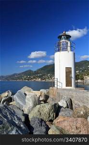 lighthouse over the sea in Camogli, Italy
