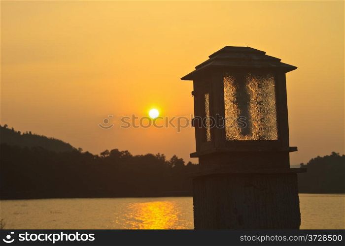 lighting pole and sunset at camping ground kaeng krachan Dam, Phetchaburi, Thailand