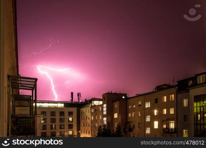 Lightning on the cloudy sky, urban city life with buildings, Austria