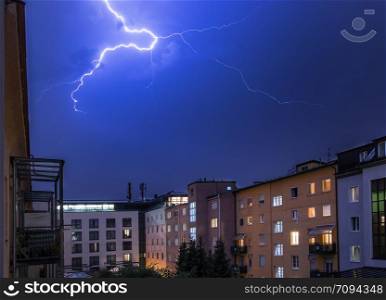 Lightning on the cloudy sky, urban city life with buildings, Austria
