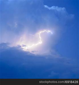 Lightnings in storm clouds. Peals of a thunder and the sparkling lightnings in clouds. Lightnings in storm clouds. Peals of a thunder and the sparkling lightnings in clouds.