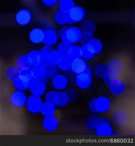 Lights blue blurred lights on black background. Square shape