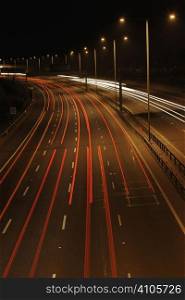 lights from cars at night time on a motorway in England