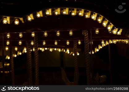 Lights on a carousel in an amusement park at night, San Diego, California, USA