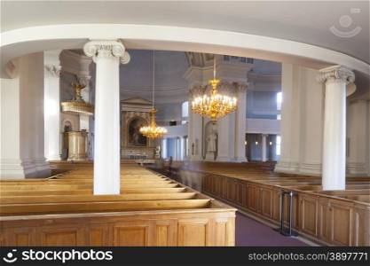 lights on in interior of helsinki cathedral