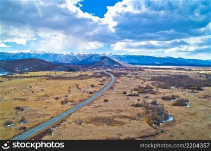 Lika region. Zir hill and Velebit mountain in Lika landscape aerial view. A1 highway. Rural Croatia 